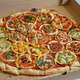 Illustration for article titled Recursive Pizza Topped With Smaller Pizzas Requires Advanced Degree to Eat
